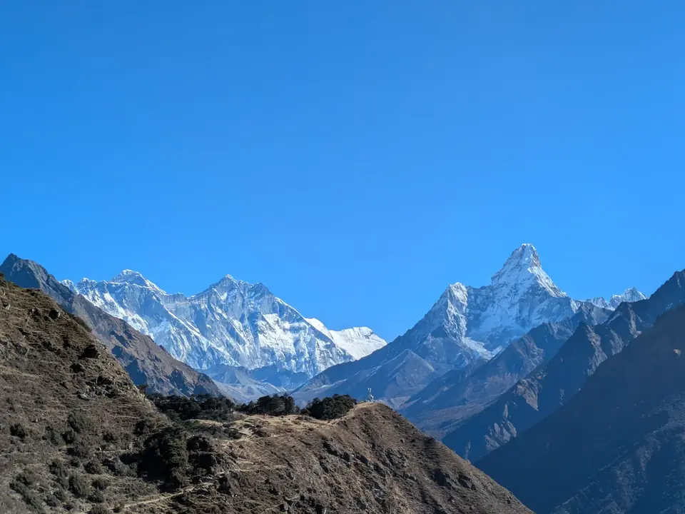 Everest, Lhotse and Ama Dablam in a panorama from the trail above Namche