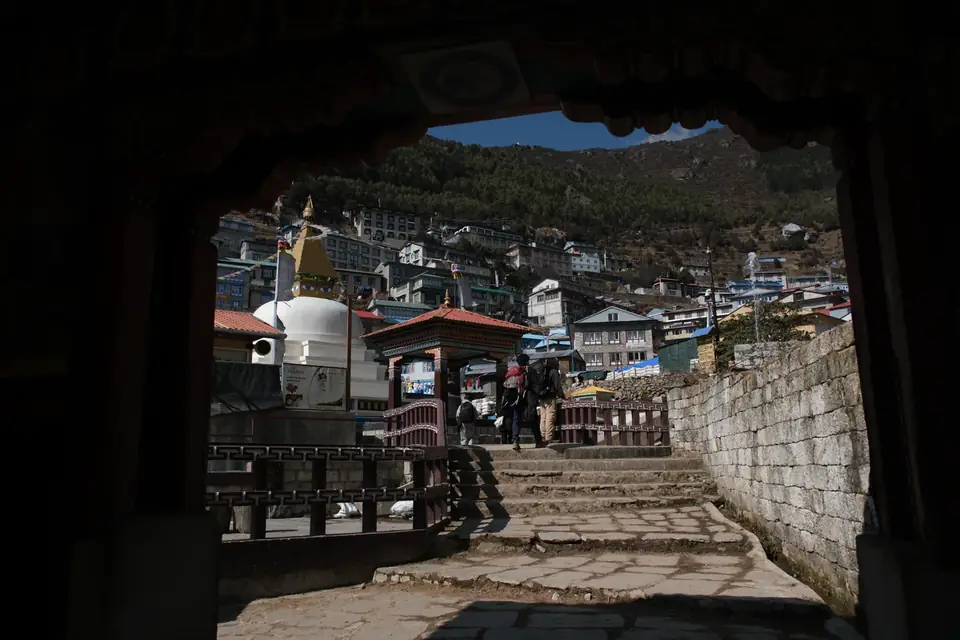 Looking through a village gateway down to Namche Bazaar